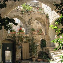 The Fauzi Azar Inn is a 200-year-old Arab mansion-turned-guesthouse, offering both dormitory beds and private rooms in a unique old-world atmosphere.