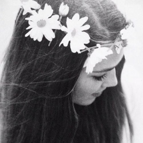City kid, island girl, flower child, shopaholic with occasionally big hair.