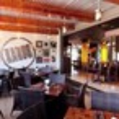 Karoo Cattle & Land is a top steak-based restaurant, featuring traditional South African fare like bobotie and boerewors. Delicious and hearty dishes. SA Style