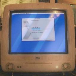 I live in the Foyer.  I am a repurposed iMac G3, lovingly coaxed into running Tiger OS. I am 10 years old. I coordinate my family's life.