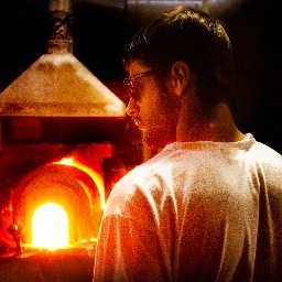 John Miguel Almaguer has been blowing glass since 2003 using sculpting, blowing, and carving to create his creations in glass.  Also found on facebook and etsy.