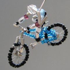 I handcraft wire into EXTREME wire people, one of a kind.  Then you hang them from your rear view mirror.