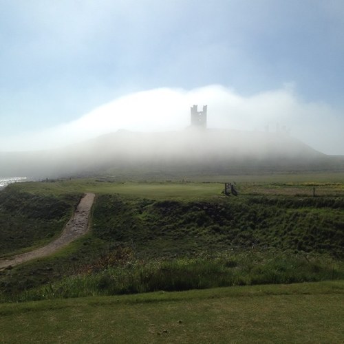 Classic 18 hole seaside links golf course designed by famous James Braid adjacent to historic Dunstanburgh Castle