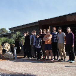 A team of students from Australia training for the Student Cluster Competition at SC14 in New Orleans. Our mascot, Happy Cheeks, is a supercomputing quokka.