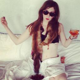 nicoleelsasser's profile picture. A serious woman with a cartoon face.