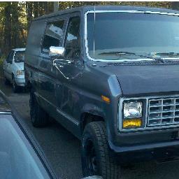 RapeVan's profile picture. The van is a large, full sized passenger van with very light blue paint The interior comforts, such as chairs, shag on the walls,  and candy gigity
