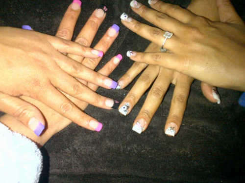 A Nail Technician adding the perfect Point