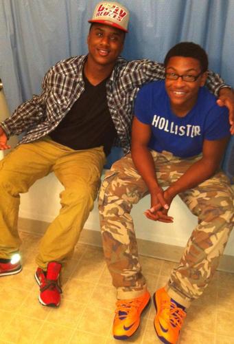 A young boy who's trynaa live it up well i can^