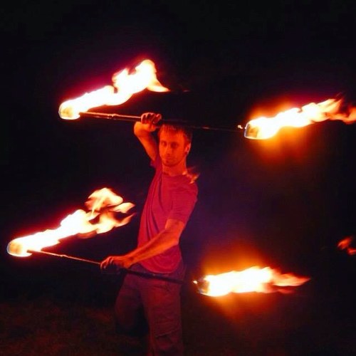 Traveling fiddle player and fire performer