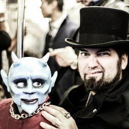 Gothic Hangman is a Surrealist artist that likes to perform ventriloquism with his self made puppet Lil' Horn