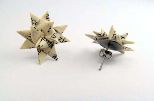 I read a book, cut it up, and fold it. I recycle old books into jewelry. I also like to tweet about libraries.