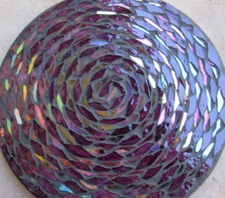 Alison gave up her day job to focus on her glass mosaic art. Custom design or artist's choice murals, wall art and garden art are available from Recluse Design.