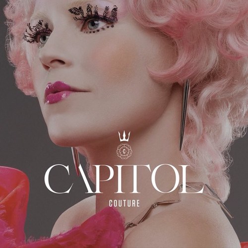 Hello, everyone! I am Effie Trinket! May the odds be ever in your favor! WARNING: I sprinkle glitter! *sprinkles glitter on you*