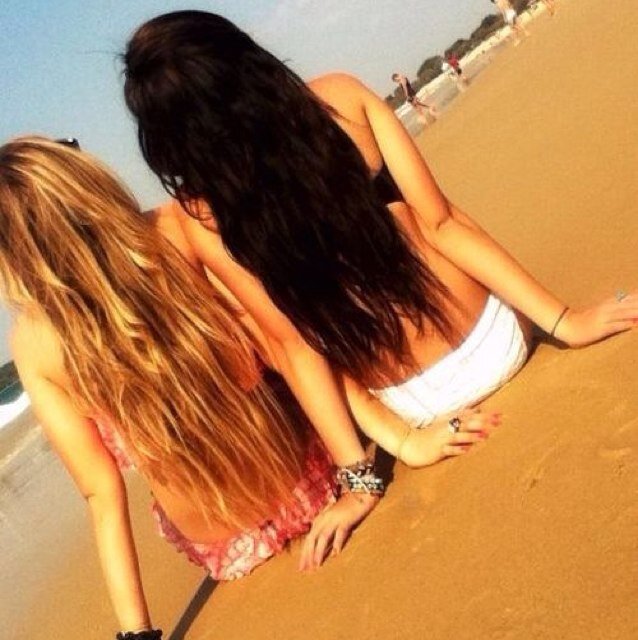 two tan girls. a brunette and a blonde with an inseparable bond. chase those cleats.