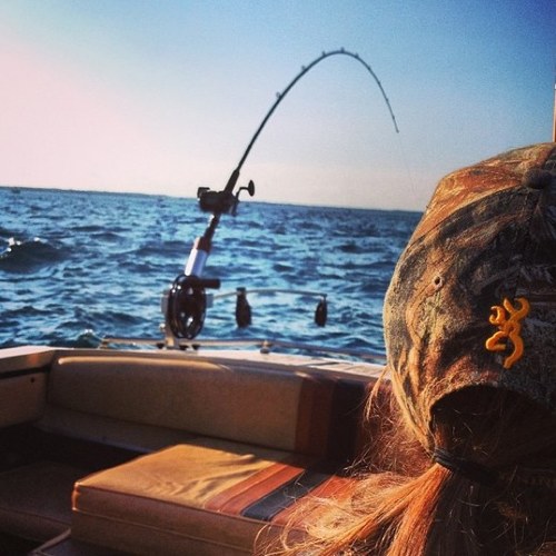 A brown hair, blue eyed girl. Gone fishing.