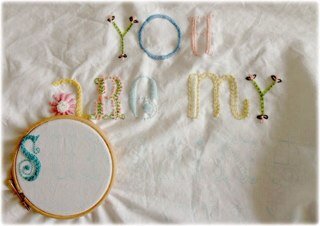 Lucy's Little Loops hand knitted baby and toddler clothes, toys and blankets made to order