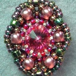 I adore costume jewelry, delight in lampwork beads, crave artisan jewelry and desire to bring bling to all Tweeople!  May your beads be many and jewelry shine!
