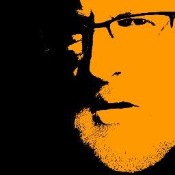 Tall, bearded, glasses, vege.  Usually found strapped to a camera, booted and lost in the hills............................shy and now retired!