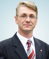 Экс-руководитель организации За свой город (закрыта властями), Экс-член Совета Беларуского Хельсинкского Комитета (закрыто властями) и ряда других организаций.