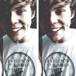 In love with 5sos bcos they're cool as frick
