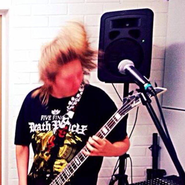 Plays bass in band called Death In Peace