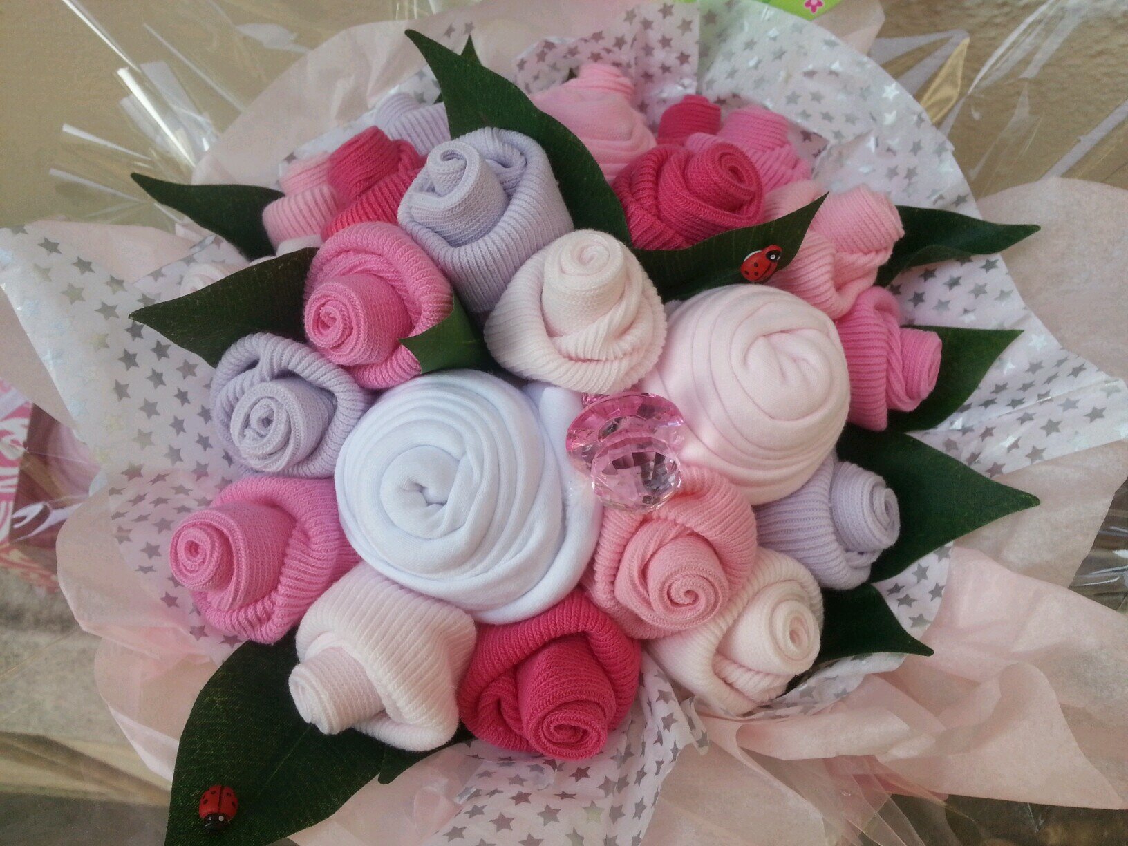 I hand craft unique gifts, Baby clothing bouquets, cupcakes, and lollipops.... chocolate/sweet explosions, sweet trees, candy-choc tiered cakes and lots more...