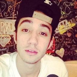 he's got a rolled cigarette hanging out his mouth