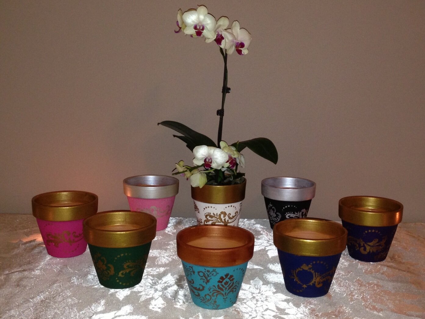 Ordinary pots made extraordinary! Pots custom painted to your liking.They make great gifts and beautiful centerpieces! Pots range in price from $10 to $14 each