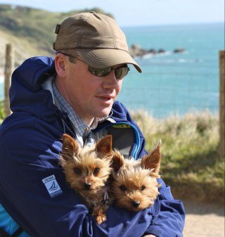 1 blind English Man, 1 French woman, 2 mini yorkies and a boat!
