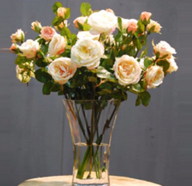 Fabulous artificial flower arrangements in artificial water.