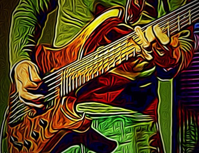 People joinin' hand in hand While the music plays the band
