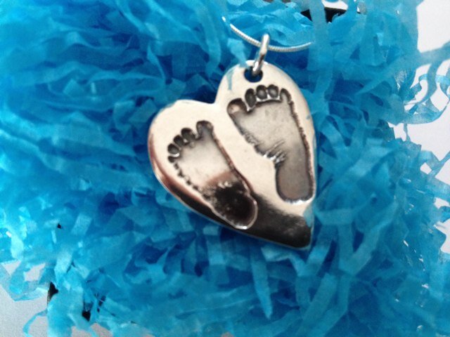 At Smallprint we turn your child or loved one's fingerprint, hand or footprint, doodles or handwriting into a piece of silver jewellery to treasure forever.