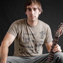 Just a guy, a guitar, and a cat.