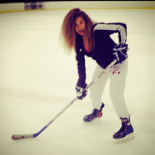 Green Eyed Curly Haired Tassel who digs hockey.