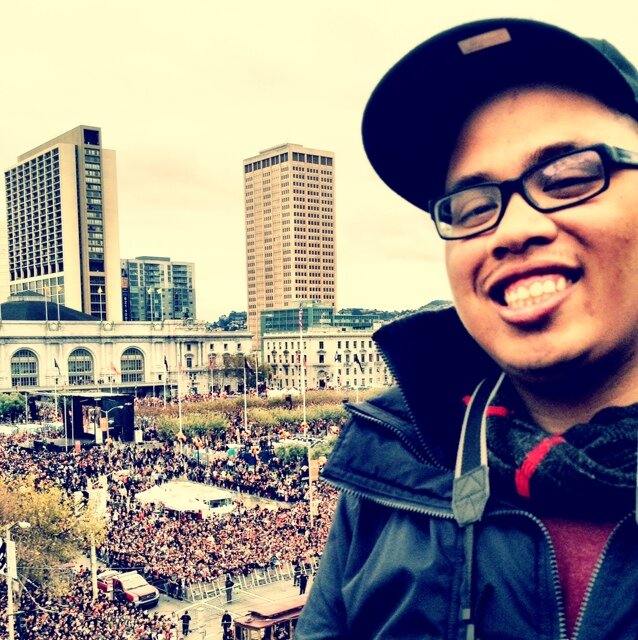A guy chasing his ambitions and some paper in a city that's consistently on go.
