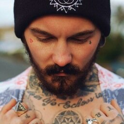Geek, guitarist, Geordie. With lots of tats.