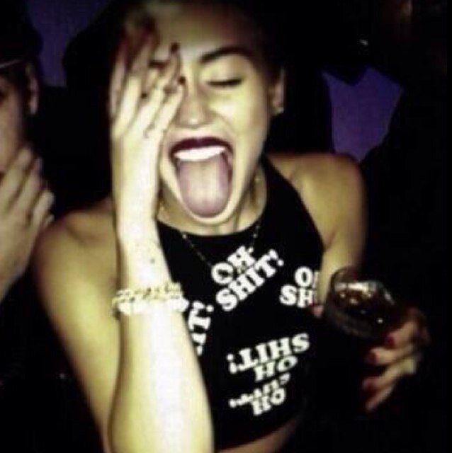 in the club high off purp with some shades, tatted up, mini skirt, put my jays on