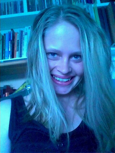 Crazy, singing, poetry writing school teacher who's going to travel the world... :P