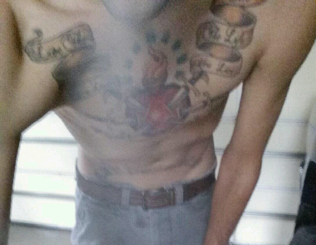Slim with a tilted grin. Country and stoned with a tattoo addiction. College Grad