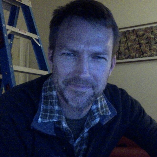 Writer with baggy eyes and dandruff