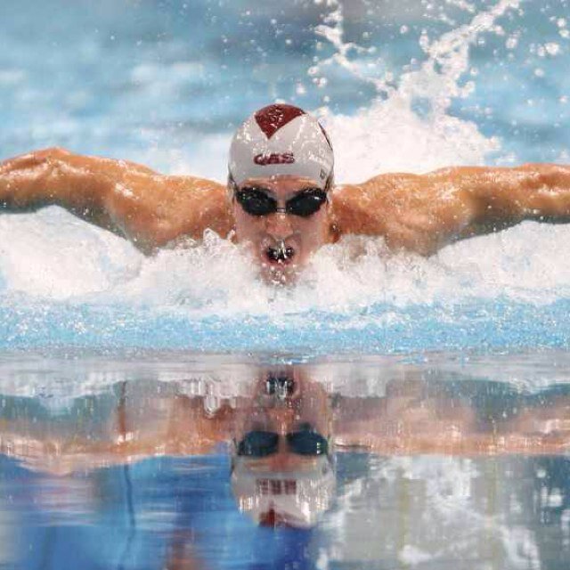 Two swimmers with swimmer problems in a swimming pool.