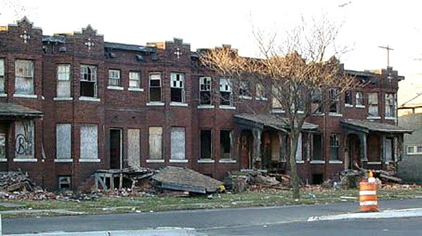 Boarded up houses, littered streets, crime, graffiti, blight...brought to you by those articulate, industrious ghetto black folk. (Parody site)