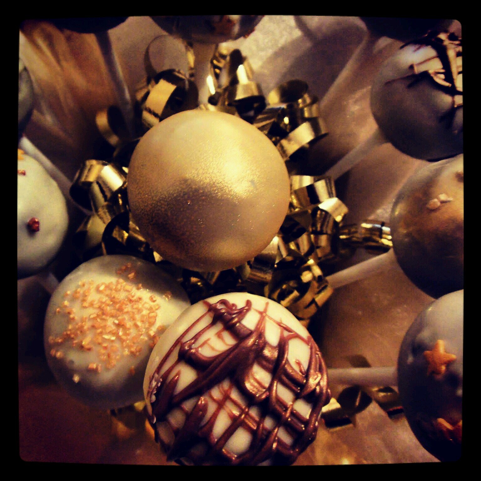 Popeyed is a growing business selling CAKE POPS: delightful cake balls covered in decadent chocolates and artistic coverings ON A STICK!