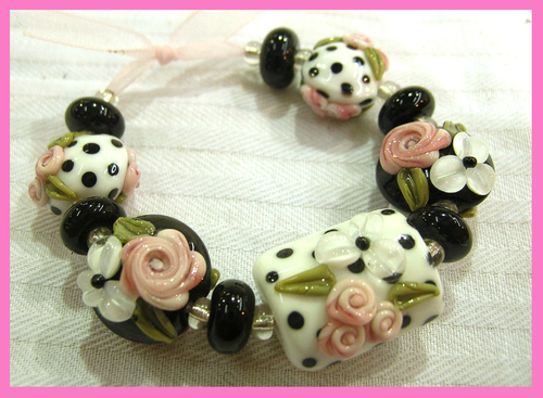 I am a lampwork artist living in Vancouver, WA. I mainly make floral lampwork beads. I am married and have four children and love soccer.