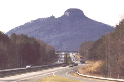 Approach from any direction & see Pilot Mountain rising more than 1400 feet above the rolling countryside of the Piedmont plateau. Not affiliated with the town.