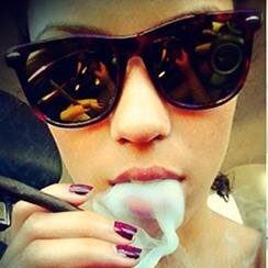 I'm that girl who is in love with all the wrong boys, alcohol and smoking blunts.