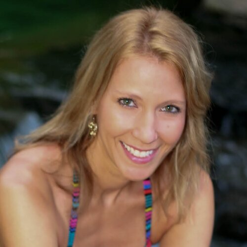 Raised in California. Lives in Carolina. Practices yoga. Swims with sharks. Believes women can do anything.