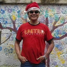 Member of United Indonesia Bali with Man United crest on his left arm