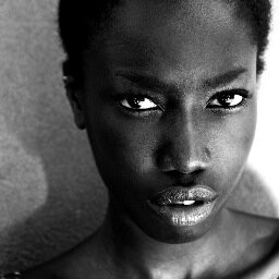 M A M B U B A Y O H draws with light and graffitis on your walls. From Liberia/ Sierra Leone. NY resident.