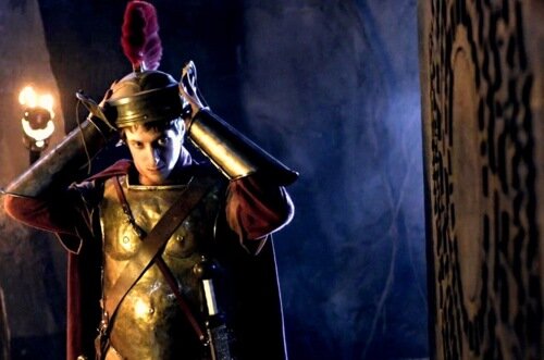 Waited 2000 years, guarded a box, carries a sword, never alone
